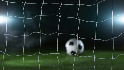 Close-up of Soccer Ball Hitiing Goal Net, Close-up.