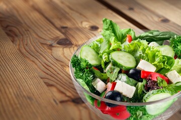 Fresh spring vegetable salad with tomatoes and peppers in the bowl.