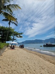 View of the sand from the side of a beach in Ilha Bela in Brazil
