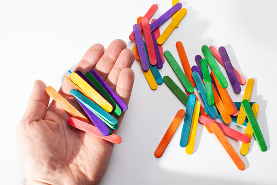 hand with wooden sticks for children's math