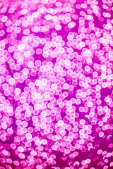 purple bokeh defocused glitter, abstract background with purple bokeh on a dark background