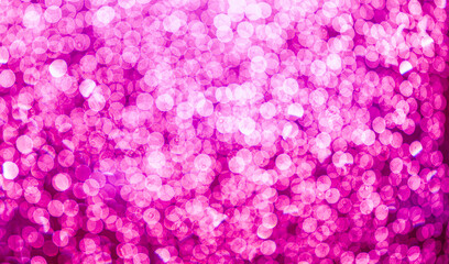 purple bokeh defocused glitter, abstract background with purple bokeh on a dark background