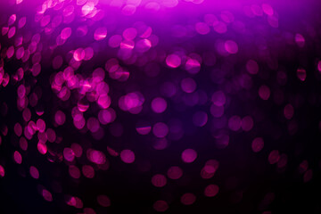 purple bokeh defocused glitter, abstract background with purple bokeh on a dark background
