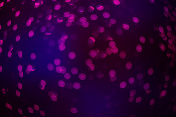 purple bokeh defocused glitter, abstract background with purple bokeh on a dark background
