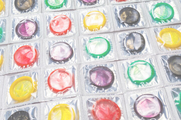 Colorful condoms background.