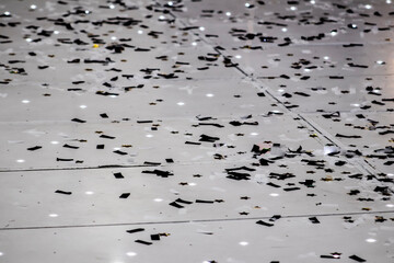 Black and White Party Confetti on the Floor of an Event Space