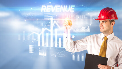 Young businessman with helmet drawing on virutal screen