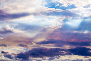 Obraz premium Sunlight Breaks through the Clouds and Turns Them Pink and Purple in Lafitte, Louisiana, USA
