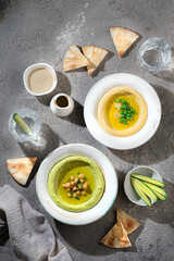 Traditional Hummus with snow peas and chick peas, with water and fresh vegetables