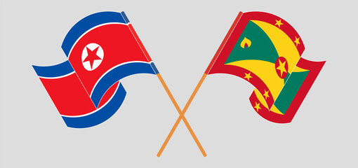 Crossed and waving flags of North Korea and Grenada
