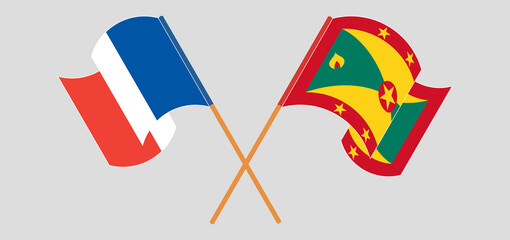 Crossed and waving flags of France and Grenada