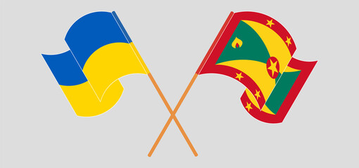 Crossed and waving flags of Ukraine and Grenada