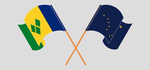 Crossed and waving flags of Saint Vincent and the Grenadines and the State of Alaska