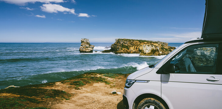 Transporter Camping Van bus at the California Ocean in the coastal Nature