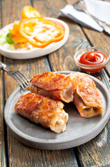 fried rolls with bacon and mushrooms on plate
