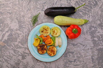 baked vegetables eggplant, pepper, onion, zucchini, cucumbers, mushrooms on a plate photo dishes for the menu of a cafe bar restaurant