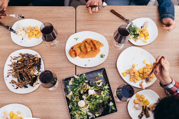 zenith shot of 4 people eating at a restaurant table