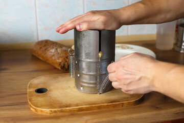Device for cooking ham at home. Homemade sausage. The process of cooking food at home. Healthy food concept.