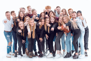 group of happy young people pointing at you