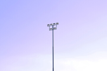 stadium lights against blue sky