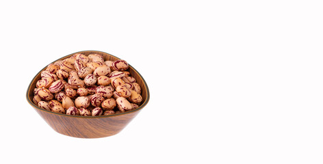Phaseolus vulgaris - Raw dry pinto beans in wooden bowl