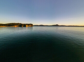 Sunrise over Cooks Beach coastline along the Coromandel Peninsula in New Zealand's North Island.