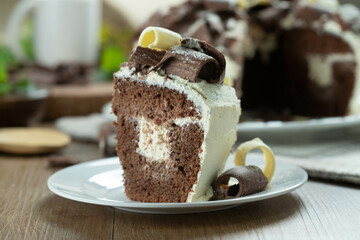Close up piece of White chocolate and dark chocolate cake two loves on wooden table. Birthday and wedding cake