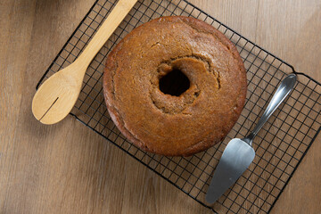 Brazilian corn cake made with a type of corn flour (Fuba). On a wooden party table. Typical sweets of the June festival. Cornmeal cake. Top view