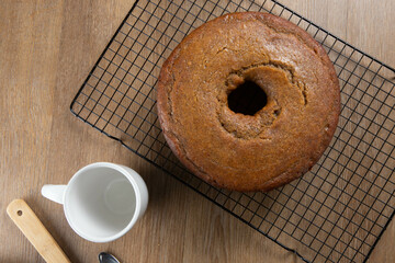 Brazilian corn cake made with a type of corn flour (Fuba). On a wooden party table. Typical sweets of the June festival. Cornmeal cake. Top view