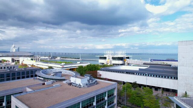 Lisbon, Portugal, April 24, 2022: DRONE AERIAL FOOTAGE: The Parque das Nacoes (Park of Nations), is a neighborhood in Lisbon constructed for the 1998 Lisbon World Exposition.