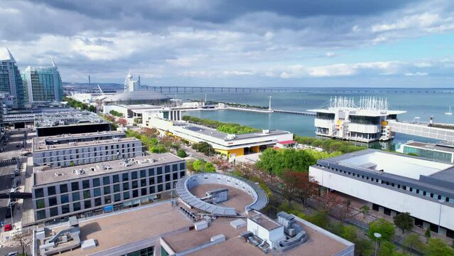 Lisbon, Portugal, April 24, 2022: DRONE AERIAL FOOTAGE: The Parque das Nacoes (Park of Nations), is a neighborhood in Lisbon constructed for the 1998 Lisbon World Exposition.