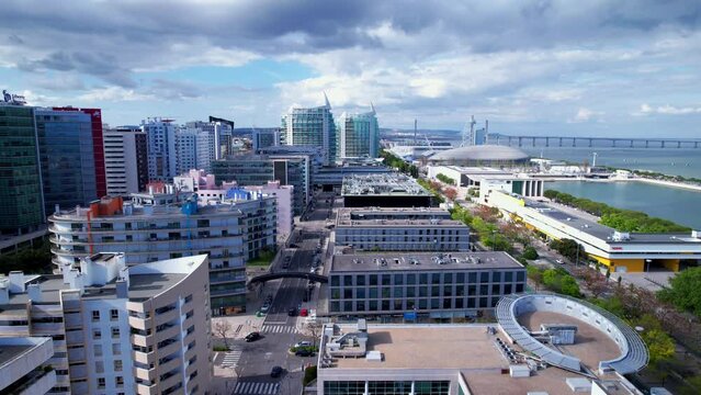 Lisbon, Portugal, April 24, 2022: DRONE AERIAL FOOTAGE: The Parque das Nacoes (Park of Nations), is a neighborhood in Lisbon constructed for the 1998 Lisbon World Exposition.