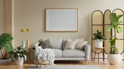 Mock up poster frame in modern interior with sofa and accessories in the room.