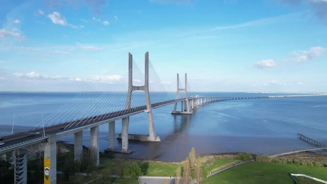 DRONE AERIAL FOOTAGE: The Vasco da Gama Bridge is a cable-stayed bridge located in the city of Lisbon in Portugal and crosses the Tagus River. It is the second-longest bridge in Europe.