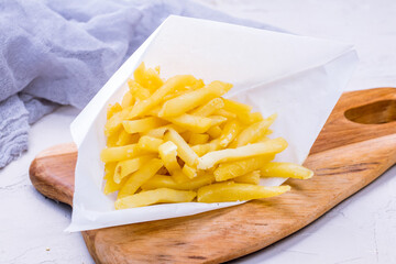 french fries on the board side view