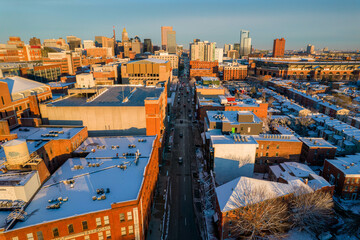 Aerial Drone View of Baltimore Snow Covered Houses with Downtown in the Distance at Sunset