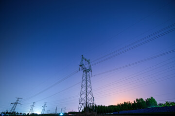 Power towers in the night sky