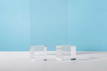 Acrylic plate, podium solid blocks, background for cosmetic product packaging on blue with stylish...
