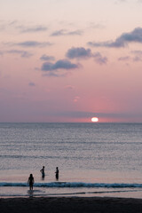 Silhouettes of friends on the beach