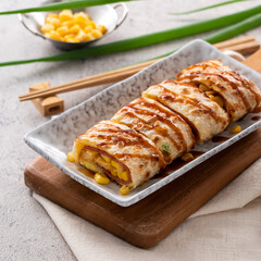 Delicious Taiwanese omelette, egg pancake roll with ham and corn kernels.