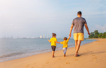 Father with children on the beach