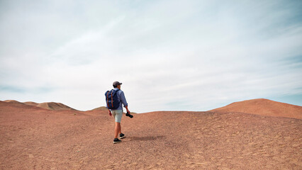 asian man backpacker photographer looking at view outdoors