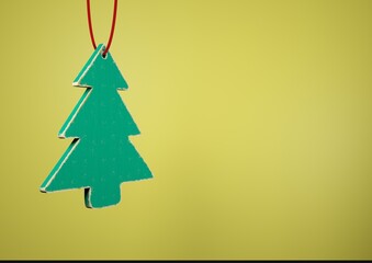 Old toy wooden Christmas tree on yellow background