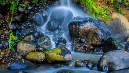 natural big stone with water splash natural rocks wet with water
