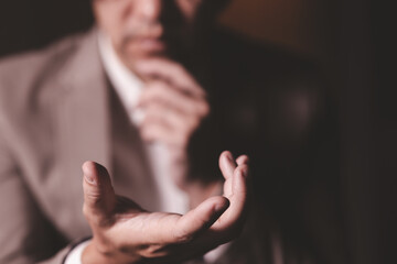 Obraz premium Close up hand of businessman with hand in the air. Concept of technoloy for business.