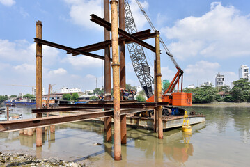 Large construction in the river for urban flood prevention. Industry execution of the steel...