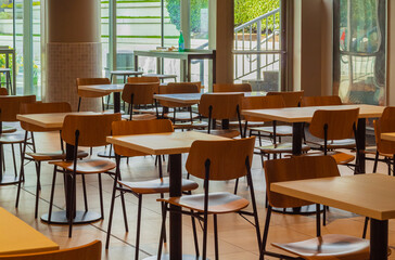 Modern and simple cafe interior with wooden classical furniture.