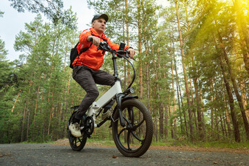 Bike cyclist riding single track. Riding an electric modern bicycle. Cool fashionable bike with...