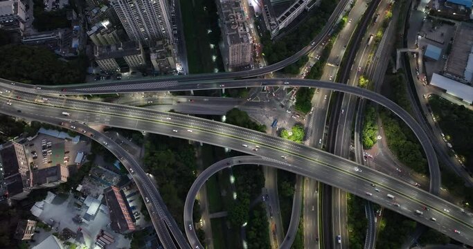 Aerial footage of night view buildings with interchange overpass in shenzhen city,China