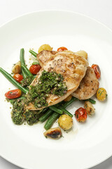 grilled chicken breast with argentina chimichurri sauce and vegetables meal